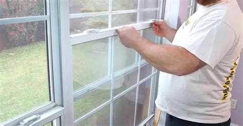 metal house window won't go up catches on nothing|double hung window not staying up.